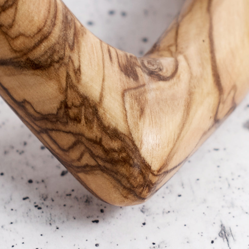 Intertwined olive wood hearts - handcrafted creation