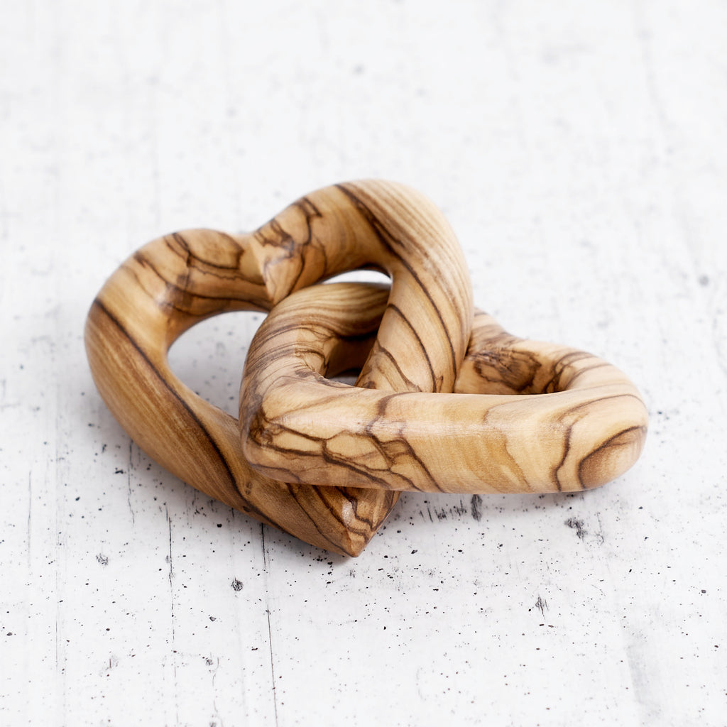 Intertwined olive wood hearts - handcrafted creation