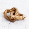 Intertwined olive wood hearts - handcrafted creation